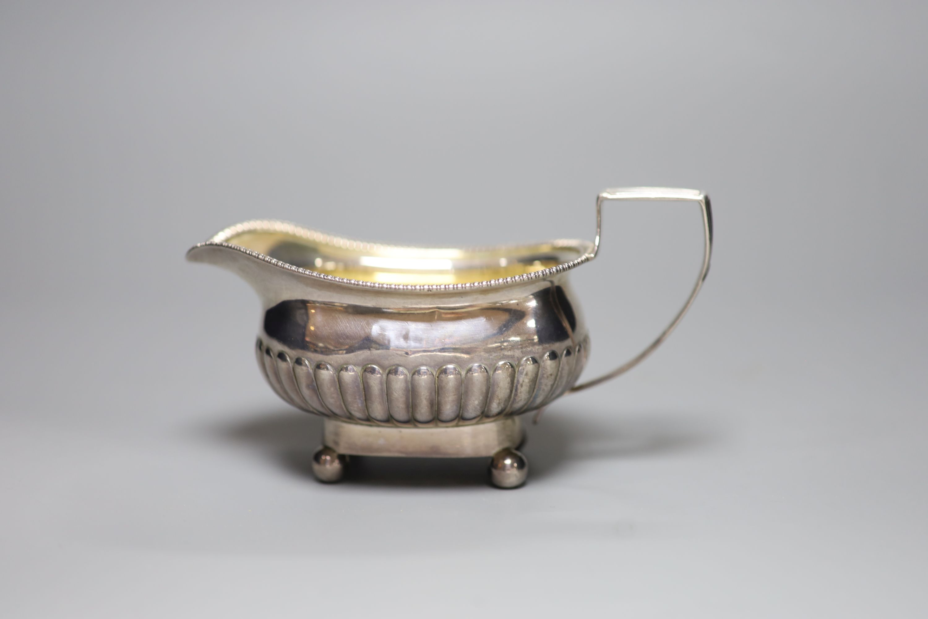 A William IV demi fluted silver cream jug, London, 1833